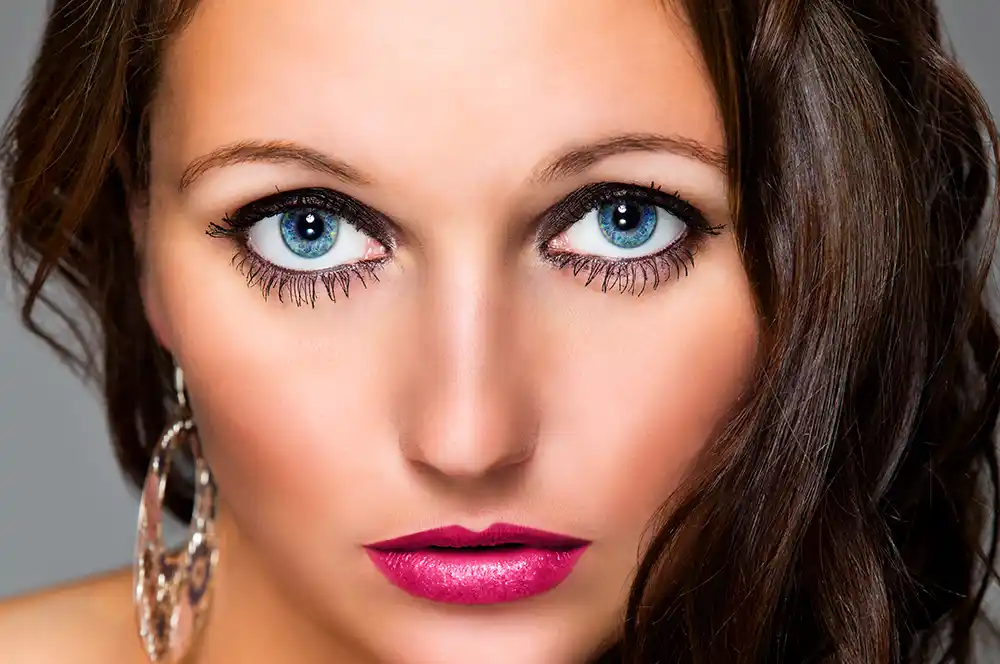 A close-up portrait after receiving our beauty retouching service, showing perfect skin and beautifully enhanced eyes and lips.