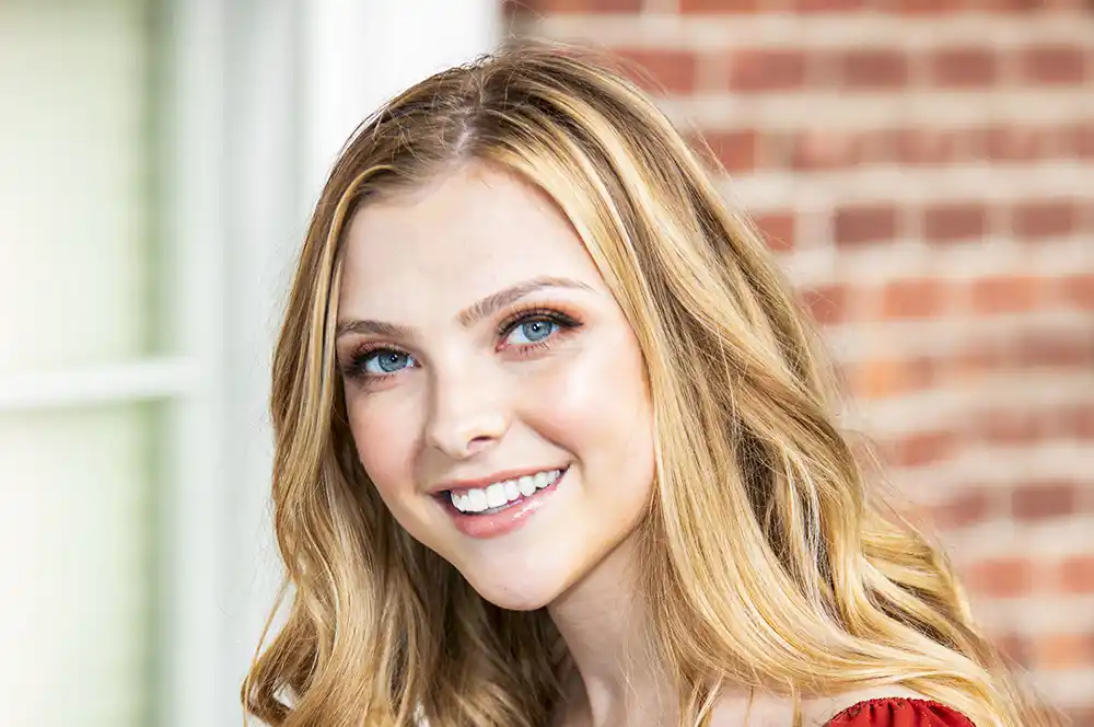 A beautiful photo of a model after receiving glamour retouching, showing a magazine-quality, flawless look.
