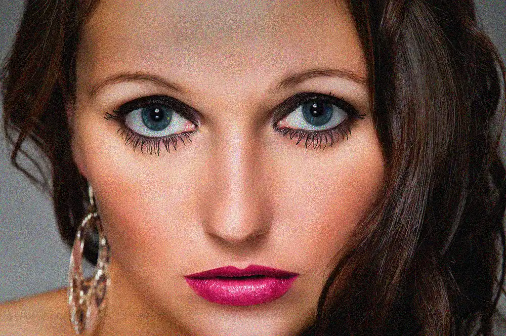 A close-up portrait of a person, shown before our beauty retouching service is done.