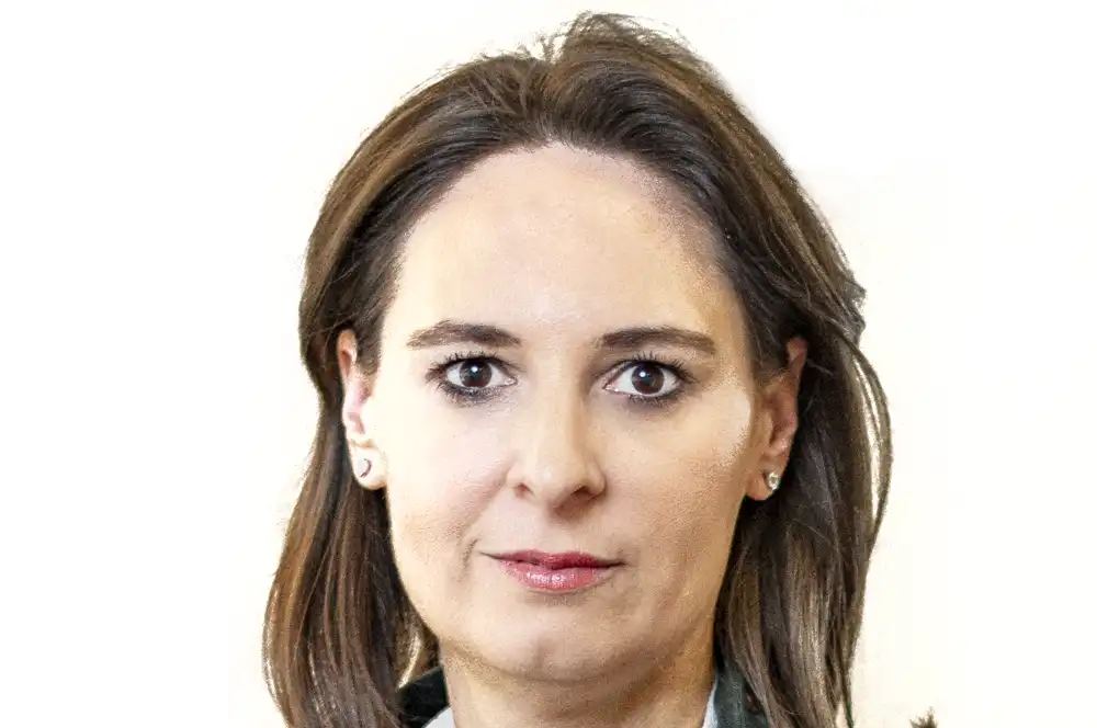 An 'after' photo of a professional portrait retouching, showing a person with clear skin on a clean white background.