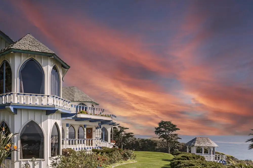 A real estate photo after a sky replacement, showing a house under a new, beautiful sky.
