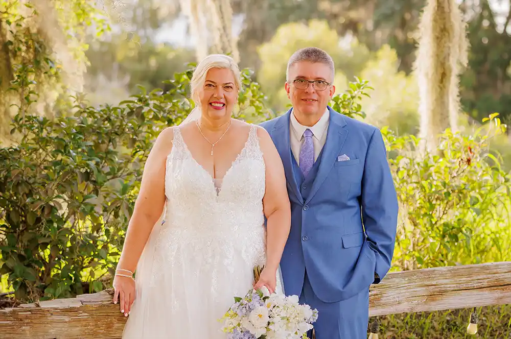A beautiful wedding photo of a couple after wedding photo retouching, showing perfect skin and bright, happy colors.